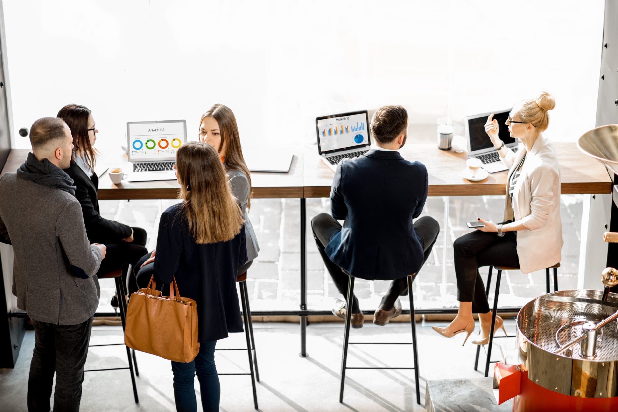 Business people talking indoors Business people talking indoors